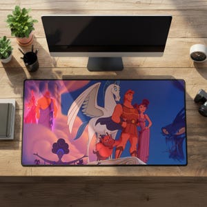 May include: A rectangular desk mat featuring a colorful animated scene with Hercules, Megara, Pegasus, Philoctetes, and other characters from the film. The design includes a dark blue sky, orange clouds, and a stylized depiction of the Greek gods.