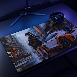 May include: A rectangular desk mat featuring an anime-style illustration of a person standing on a city street next to a white and orange sports car. The scene includes urban buildings, street lights, and a dark, moody colour palette with blue lighting.