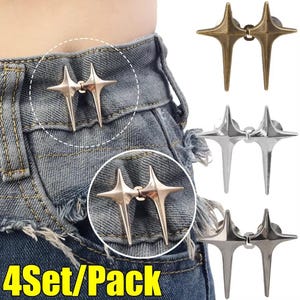 May include: A set of four metal waist cincher pins featuring a double star design with sharp, elongated points. The pins are available in bronze, silver, and dark metallic finishes, shown attached to the waistband of blue denim jeans. 4Set/Pack.