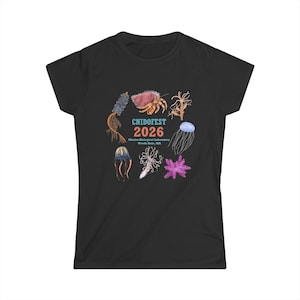 May include: A black short-sleeve t-shirt featuring a central graphic of various marine organisms surrounding the text CNIDOFEST 2026 Marine Biological Laboratory Woods Hole, MA. The colorful illustrations include jellyfish, coral, and other sea life.