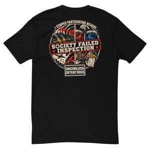 May include: A black t-shirt featuring a circular graphic on the back. The design includes the text "I STOPPED PARTICIPATING BECAUSE...", "SOCIETY FAILED INSPECTION", and "UNCIVILIZED INTENTIONS" alongside illustrations of industrial pollution, a puppet master, and rising costs.