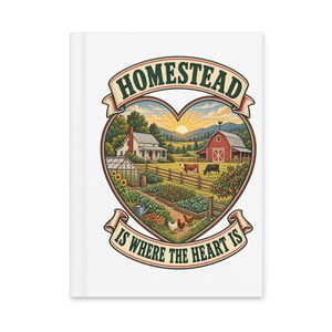May include: A white hardcover journal featuring a heart-shaped illustration of a farm scene with a house, red barn, garden, cows, and chickens. The text HOMESTEAD IS WHERE THE HEART IS is printed in dark green letters on banners above and below.