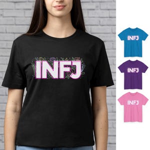 May include: Black t-shirt with the word "INFJ" in white, outlined in pink, and surrounded by a floral design. Additional t-shirts in blue, purple, and pink with the word "INFJ" are also shown.