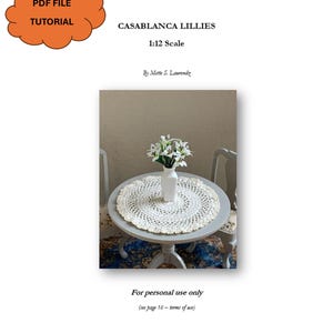 May include: A PDF tutorial for "CASABLANCA LILLIES" at 1:12 scale. The image features a small round table with a white crocheted doily and a white vase holding white flowers. The text on the image reads "For personal use only."