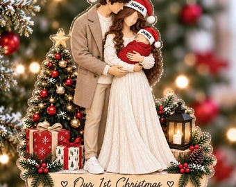 May include: A clear acrylic Christmas ornament featuring a family of three wearing Santa hats labeled Noah, Sophia, and James. The scene includes a decorated tree, gifts, and a lantern. Text reads: Our 1st Christmas as a Family off Three 2026.