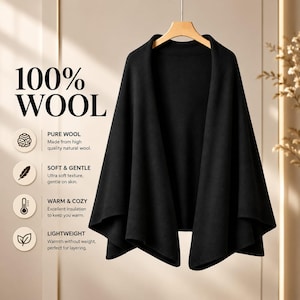 Puede incluir: Un chal de lana negro sólido con frente abierto colgado en una percha de madera. El texto a la izquierda dice 100% WOOL, PURE WOOL Made from high quality natural wool, SOFT & GENTLE Ultra soft texture, gentle on skin, WARM & COZY, LIGHTWEIGHT.