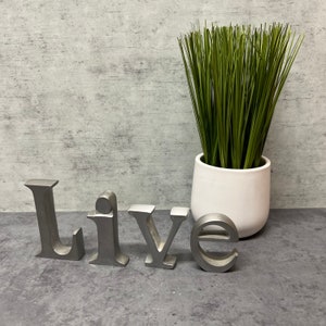 Letras vivas de aluminio: 2,12" - 3,2"
