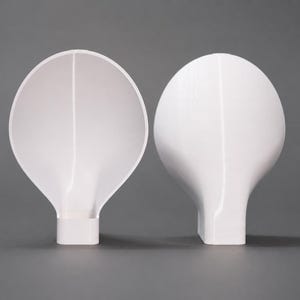 May include: Two white, smooth, bulbous objects with a rounded top and a rectangular base. One object is positioned to show its hollow, concave interior, while the other is oriented to display its solid, convex exterior surface.