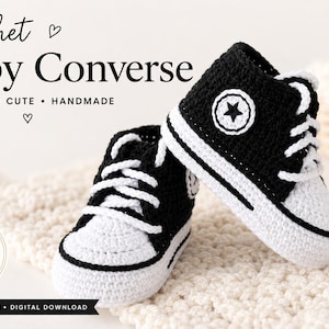 May include: A pair of black and white crochet baby trainers with white laces and a circular star patch on the side. The image includes text reading Crochet Baby Converse, Classic, Cute, Handmade, PDF Pattern, Instant Download, and Crochet Pattern.