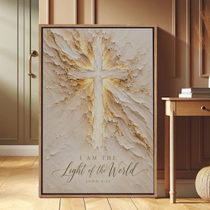 Può includere: Un'opera d'arte murale rettangolare incorniciata con un dipinto materico in stile impasto raffigurante una croce centrale che irradia luce dorata. Il testo "I AM THE Light of the World" e "JOHN 8:12" è stampato in basso.