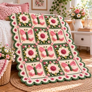 May include: A crochet blanket featuring a repeating pattern of three-dimensional pink and white butterflies and white flowers with dark pink centers. The blanket has a scalloped green border with small pink flower accents on a cream background.