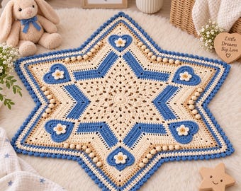 May include: A star-shaped crochet mat featuring a cream-colored center with intricate stitching, bordered by blue heart-shaped motifs and small white flower appliqués. The edges are finished with a blue scalloped trim and small beige wooden beads.