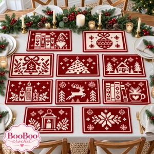 May include: A collection of ten rectangular crochet placemats in deep red and cream, each featuring distinct holiday-themed pixel art designs including a gnome, ornament, bell, tree, cabin, candles, reindeer, books, lantern, and snowflake.