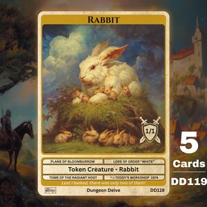 May include: A rectangular game card titled Rabbit featuring a large white rabbit with several smaller rabbits in a grassy nest. The card includes text such as Plane of Bloomburrow, Lore of Order White, Token Creature - Rabbit, and Dungeon Delve DD119.