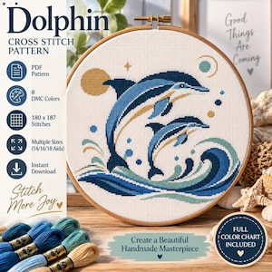 May include: A cross stitch pattern featuring two dolphins leaping from blue and teal waves, set within a wooden embroidery hoop. The design includes a yellow sun and small circular accents on white fabric. Text reads Dolphin Cross Stitch Pattern.