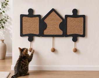 May include: A wall-mounted cat scratching set consisting of three interconnected pieces with black wooden frames and textured brown sisal centers. Two pieces are square puzzle shapes and one is house-shaped, each with a hanging rope and ball toy.