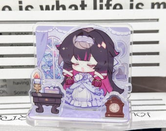 May include: A clear acrylic standee featuring a chibi-style character with dark hair and pink highlights, wearing a light purple dress. The character is positioned between a small brown table with a lit candle and a brown grandfather clock.