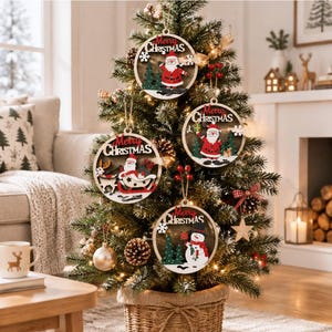 May include: Three round wooden Christmas ornaments hanging on a green tree. Each ornament features a cutout design with the text Merry Christmas, depicting Santa Claus, a reindeer with a sleigh, and a snowman with green pine trees and white snowflakes.
