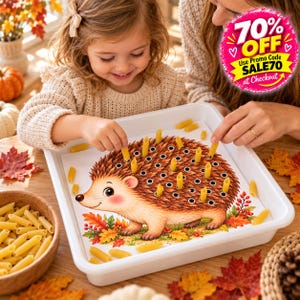 May include: A white plastic tray containing a printed illustration of a brown hedgehog with numerous holes on its back. Yellow penne pasta pieces are inserted into the holes, mimicking quills. A bowl of dry penne pasta sits nearby on a wooden surface.