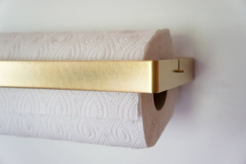 white and rose gold kitchen roll holder