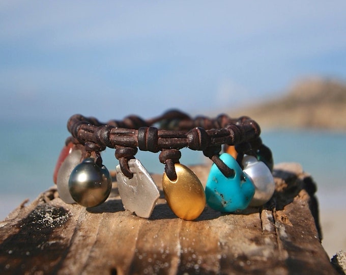 Charms genuine treasures and Gold pebble leather bracelet, cultured Tahitian fine pearls bohochic beach jewelry St Barth signature.