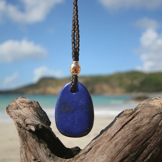 Lapis lazuli pendant necklace and 18k gold pearl mounted on leather with Tahitian pearl clasp, hand carved, beach jewelry from St Barthelemy