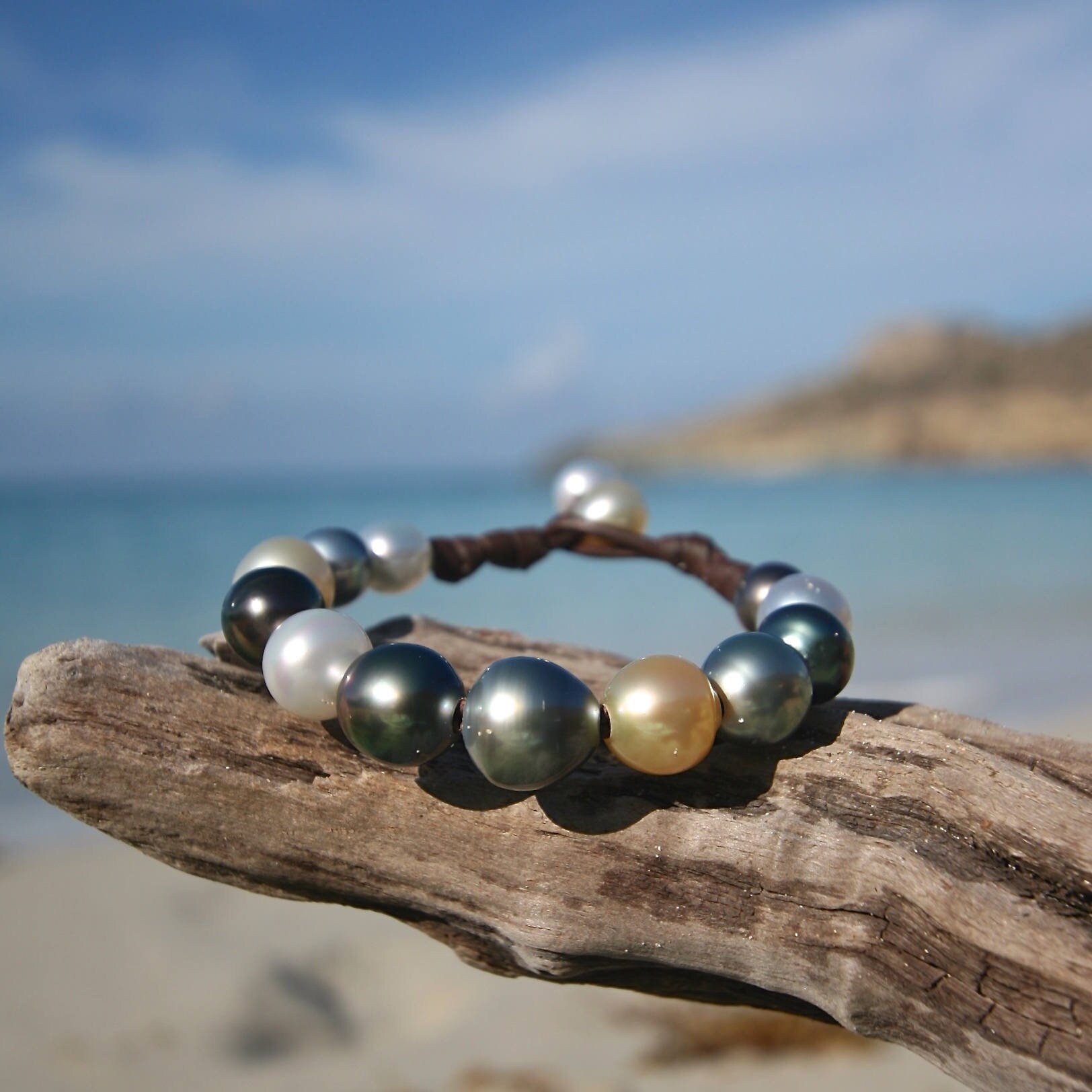 Multicolor gradient of fine cultured pearls bracelet strung on leather