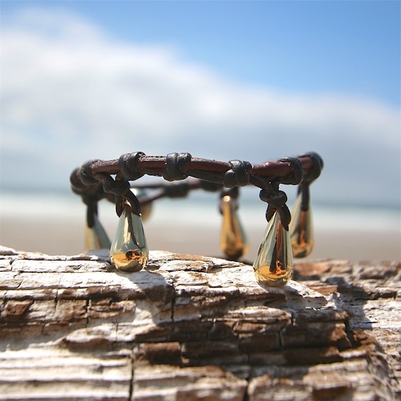 18k gold charms strung on leather, charms bracelet, gold 18 carat gold, cultured Tahitian pearls bohochic beach jewelry St Barth seaside