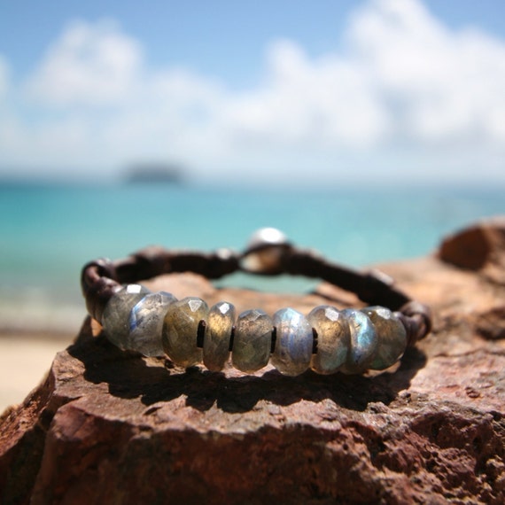 Hand faceted iridescent fire labradorite AAA quality rondelles on leather with a Tahitian cultured pearl as clasp. bohemian jewelry, gems.