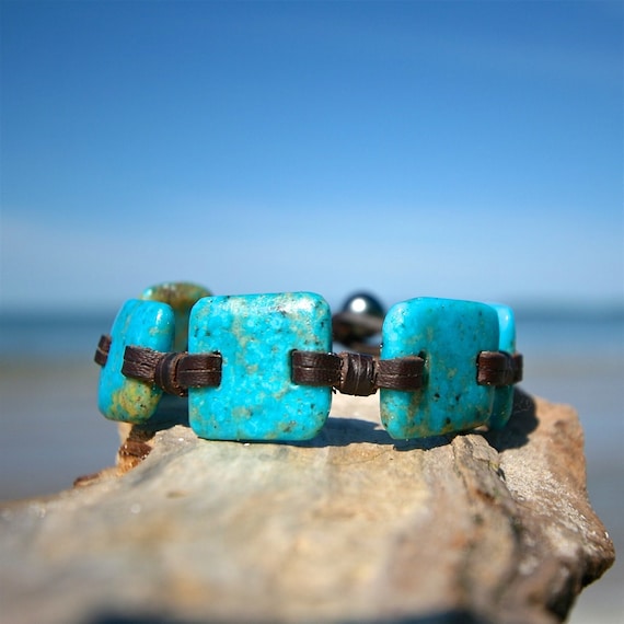 Handmade cut and polished American turquoises & Tahitian pearl clasp strung on leather, black pearl, beach jewelry, St Barts one of a kind.