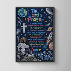 May include: A framed wall art print featuring a dark blue space background with planets, stars, a rocket, and a cross. The text reads The Lord's Prayer, with a child in a hoodie sitting on a rock in the foreground. Additional text includes Amen.