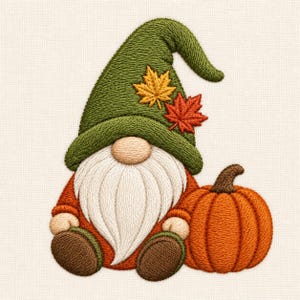 May include: An embroidered patch featuring a gnome with a long white beard, wearing a green hat decorated with two autumn leaves in yellow and orange. The gnome sits next to a round orange pumpkin with a brown stem, all rendered in detailed stitching.