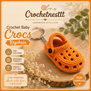 May include: An orange crochet baby clog keychain featuring a small black button on the side and a silver metal keyring. The image includes text reading Crochetnesttt, Crochet Baby Crocs Keychain, PDF Pattern, Beginner Friendly, and PDF Download.