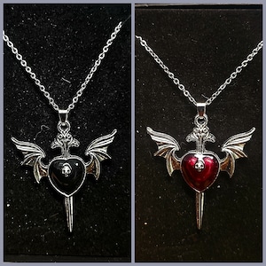 Antiqued  gothic sword with bat wings pendant. You choose heart color red or black