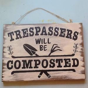 Trespassers Will be composted.Rustic wooden sign.