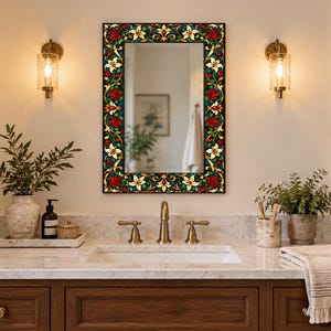 May include: A rectangular wall mirror featuring a decorative frame with a colorful stained glass pattern of red roses, white lilies, and green leaves set against a dark background, mounted above a bathroom vanity sink.