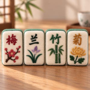 May include: Four rectangular felt tiles featuring embroidered Chinese characters and botanical motifs. The tiles display a red plum blossom, a purple orchid, a green bamboo stalk, and a yellow chrysanthemum, each with a dark green felt border.