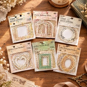 May include: Six rectangular packages of decorative stickers featuring intricate lace and frame designs. The labels include text such as Time and Space Lovers, Floral Archway Door, Hollow Lace Stickers, Hollow Frame Road, and Coffee Packaging Stickers.