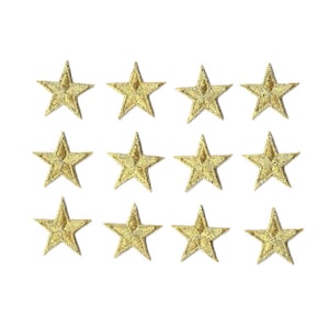 May include: Twelve gold star-shaped iron-on patches. The stars are approximately 1 inch in diameter.