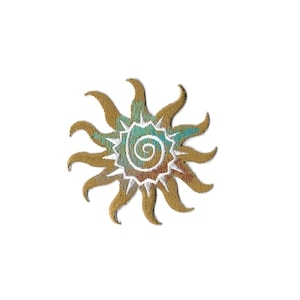 May include: A gold embroidered sun with a white spiral design in the center. The sun has a turquoise and orange gradient.