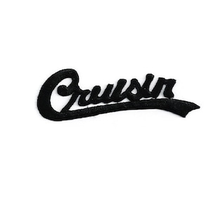 May include: Black iron-on patch with the word "Cruisin'" in a white cursive font.