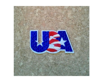 May include: A blue, red, and white embroidered patch with the word "USA" and a star. The "S" is a red, white, and blue American flag.
