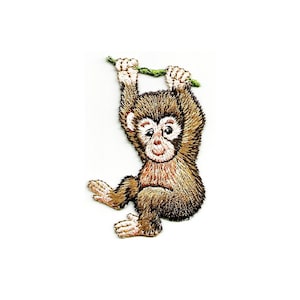 May include: Embroidered iron-on patch of a brown monkey hanging from a green branch. The monkey has a light brown face and a pink nose.