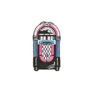 May include: A vintage-style black and white jukebox with pink and blue accents. The jukebox has a round, glass window and a grid-like pattern on the front.