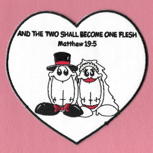 May include: White heart-shaped patch with black outlines. The patch features a cartoon illustration of a bride and groom with the text "And the two shall become one flesh Matthew 19-5".