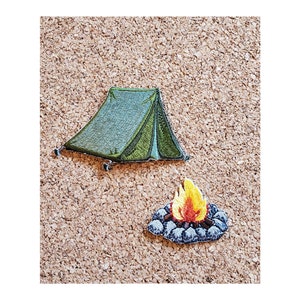 May include: Green camping tent with a campfire in front of it. Both are embroidered patches.