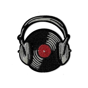 May include: A black and white embroidered patch of a vinyl record inside a pair of headphones. The record has a red center label.