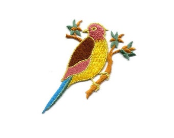May include: Embroidered iron-on patch of a yellow, pink, and brown bird perched on a branch with green leaves.