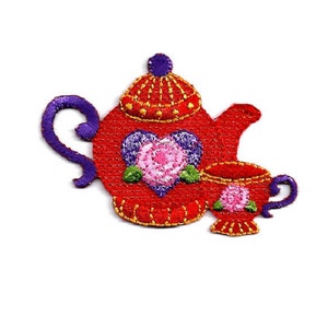 May include: Red and purple embroidered teapot and cup with a pink rose and heart design.