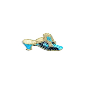 May include: A blue and gold sequined slipper with a high heel. The slipper has a flower design on the top.